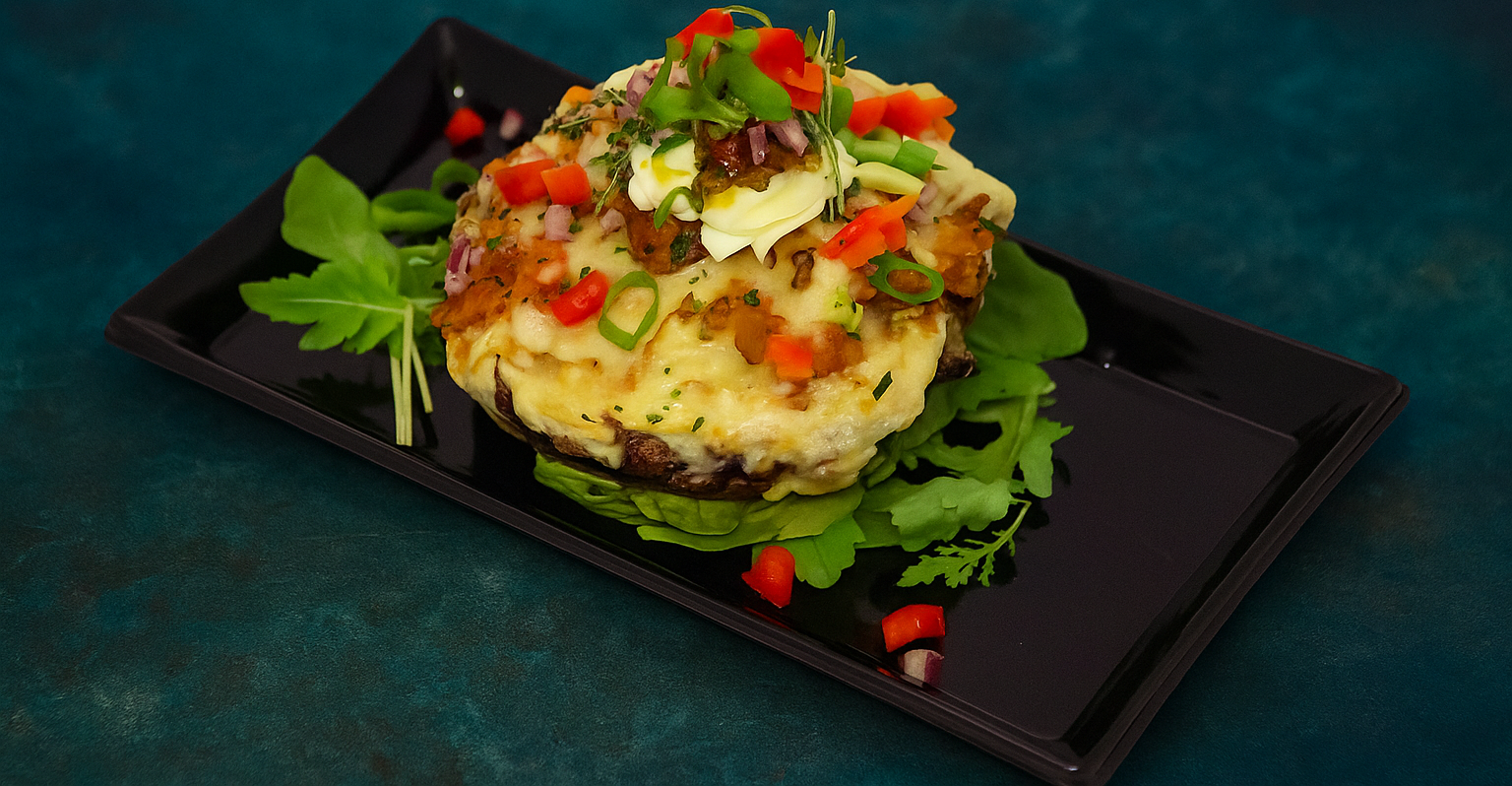 Portobello met zoete aardappel en confit de canard